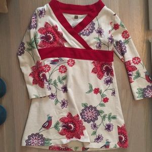 Adorable cream dress with birds and flowers.